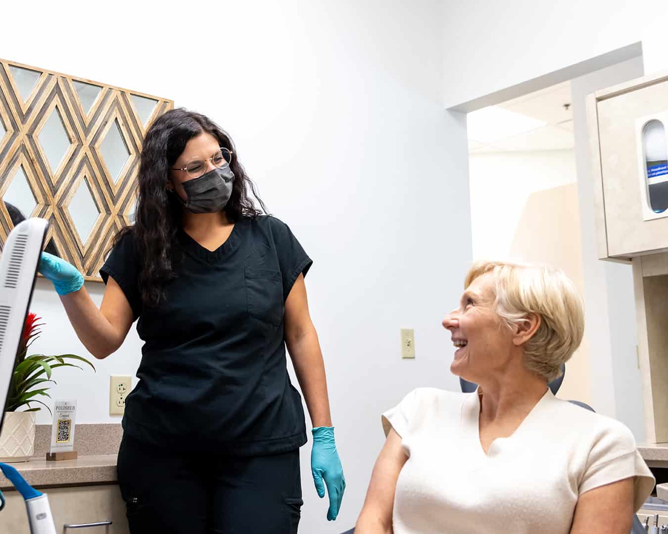 Polished Dentist Consulting With Patient for Immediate Treatment